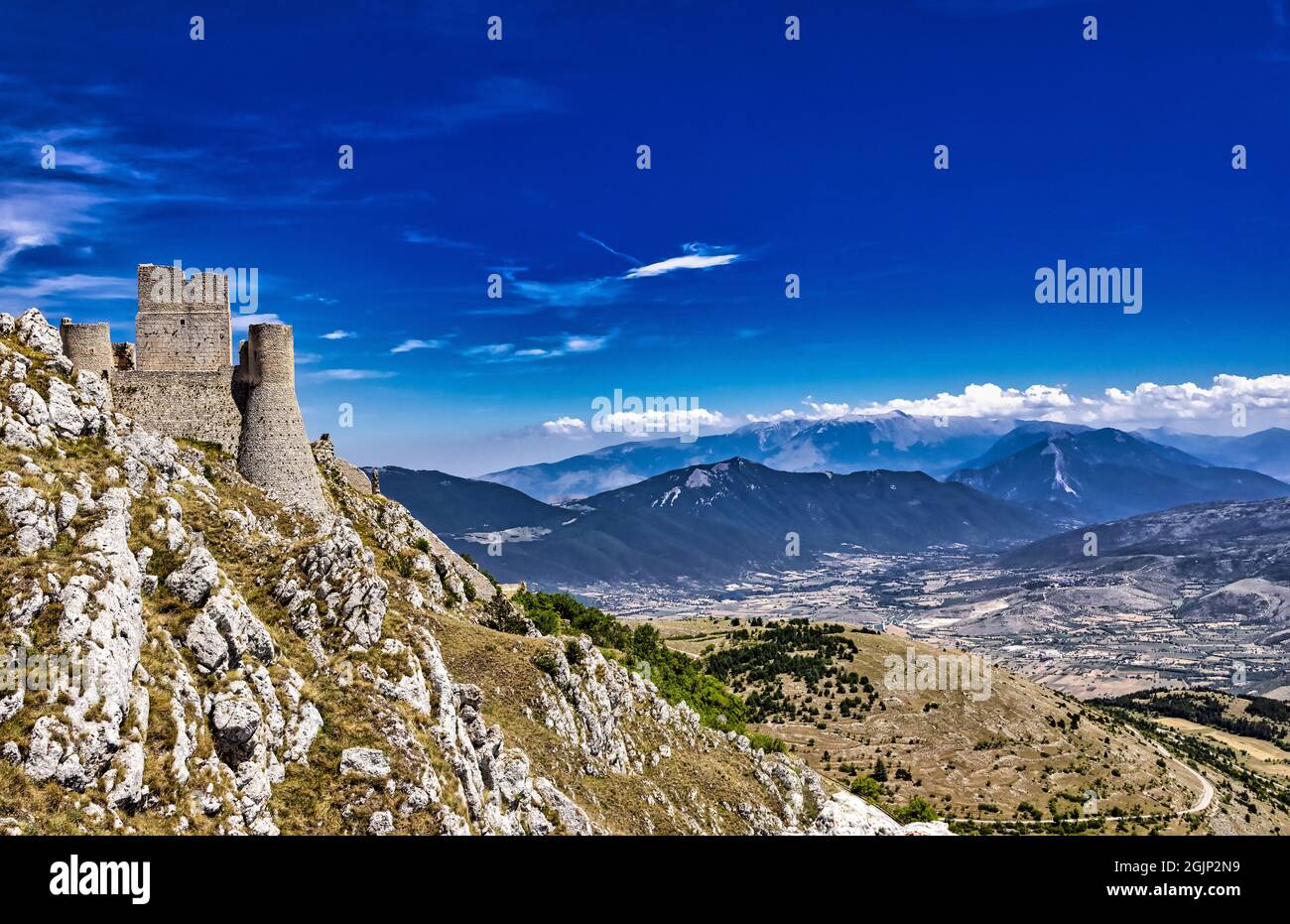 Ruined and abandoned dreamlike medieval castle on a mountain peak in Rocca Calascio, L'Aquila, Italy Stock Photo