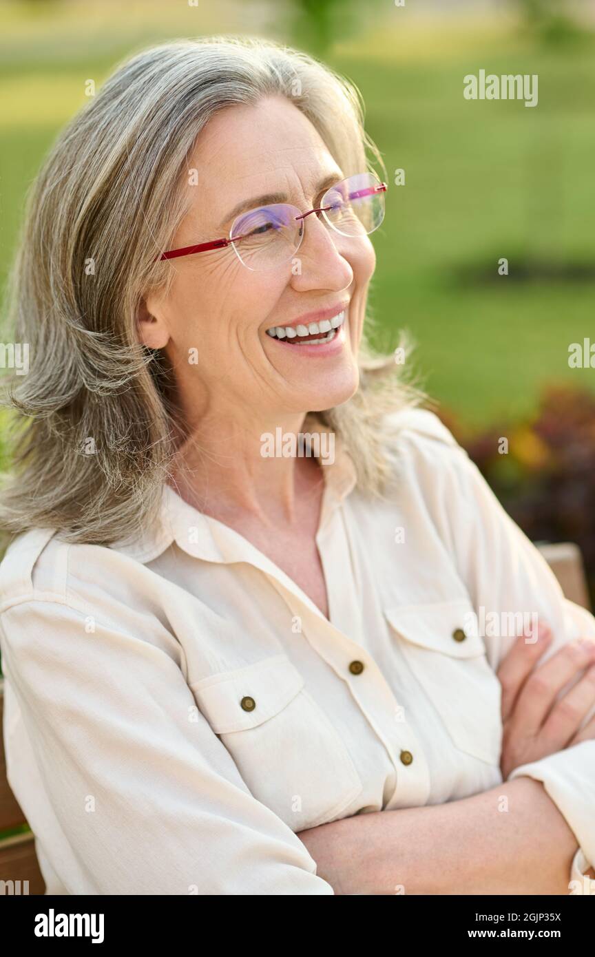Happy adult woman outdoors in afternoon Stock Photo