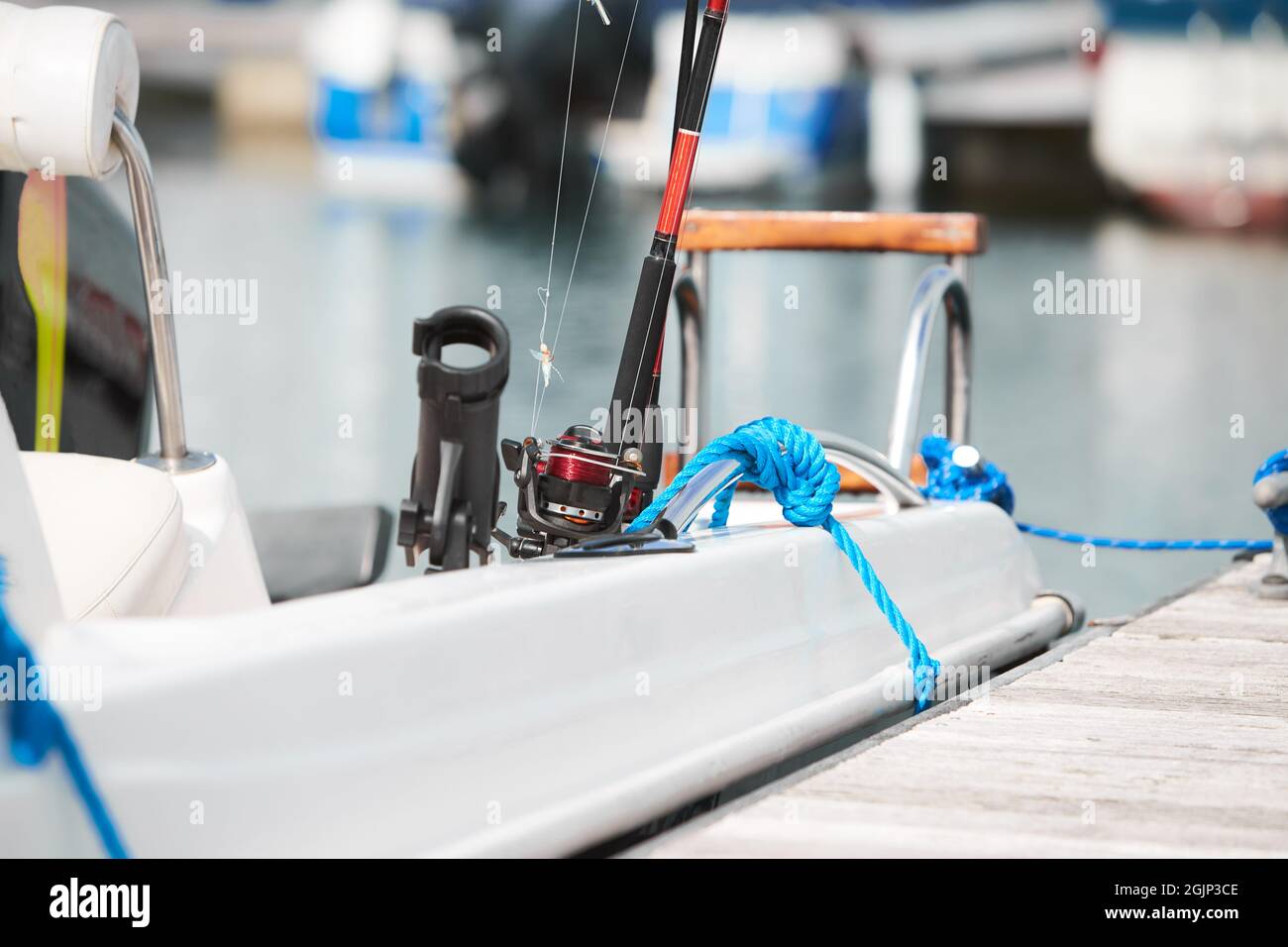 Fishing accessories - black rod holder on a board Stock Photo - Alamy