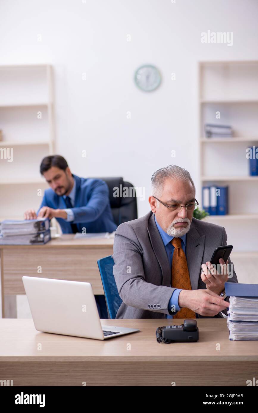 Two colleagues working at workplace Stock Photo