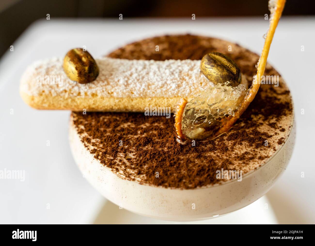 Tiramisu as served in Ritz Carlton hotel, a coffee-flavored Italian dessert, made of ladyfingers dipped in coffee Stock Photo