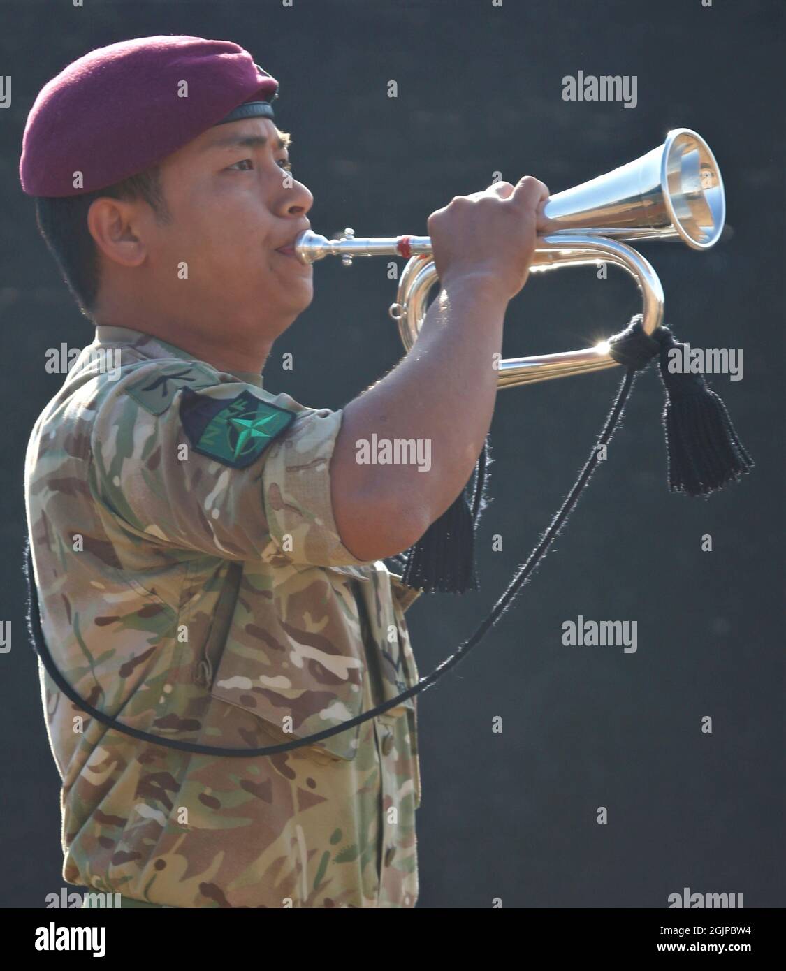 Ferizaj, Kosovo. 11th Sep, 2021. LCpl Neshum Tamang from the 1st Royal Gurkha Rifle Regiment, plays taps during a remembrance event on the 20th anniversary of the 9/11 terrorist attacks at Camp Bondsteel September 11, 2021 in Ferizaj, Kosovo. The event commemorates the nearly 3,000 people killed by terrorists on September 11th, 2001. Credit: Capt. Mikel Arcovitch/U.S. Army/Alamy Live News Stock Photo