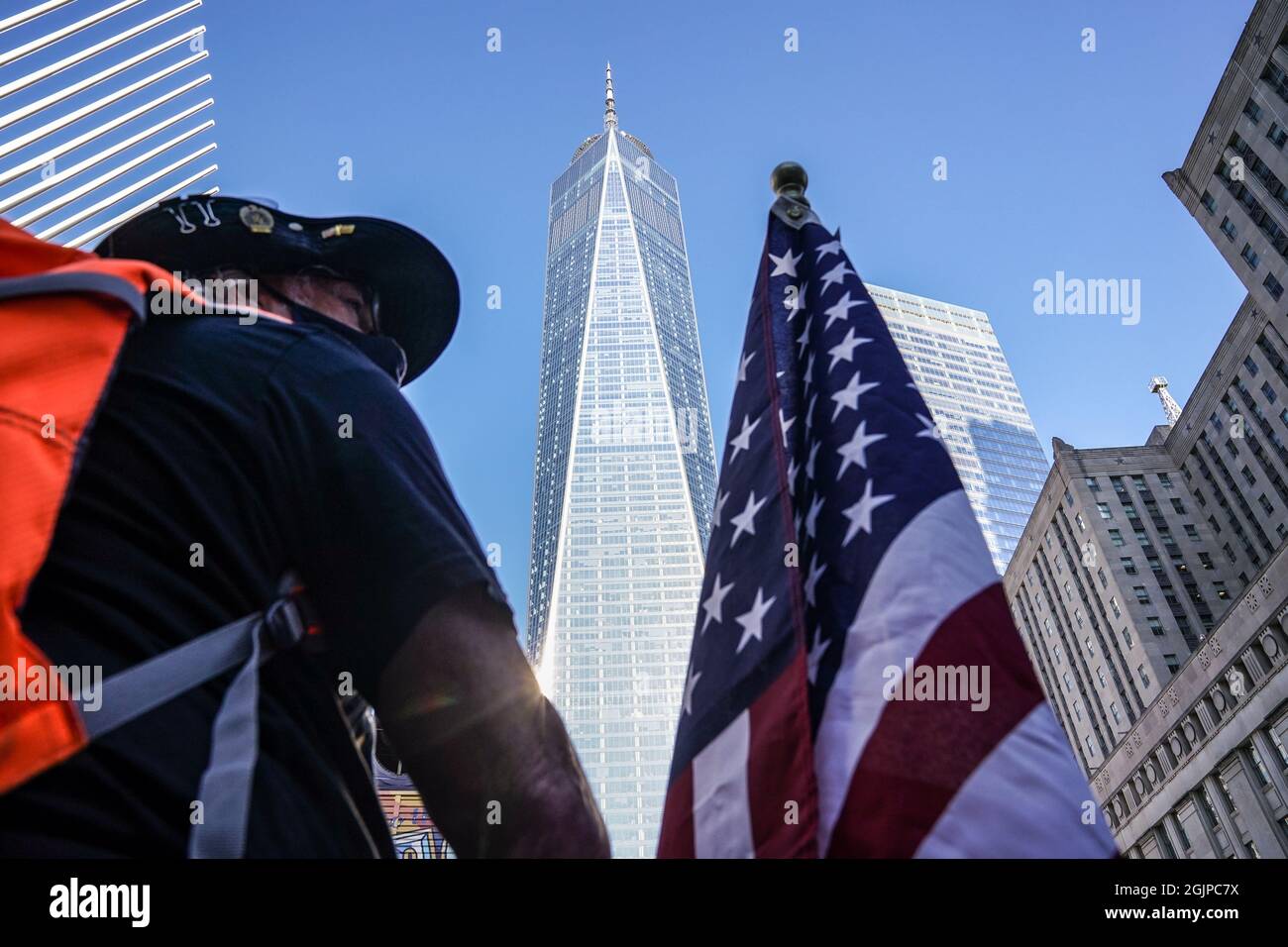 New York, USA. 11th Sep, 2021. People gather in front of One World Trade Center on the 20th anniversary of the September 11th terrorist attacks in New York, USA. Credit: Chase Sutton/Alamy Live News Stock Photo