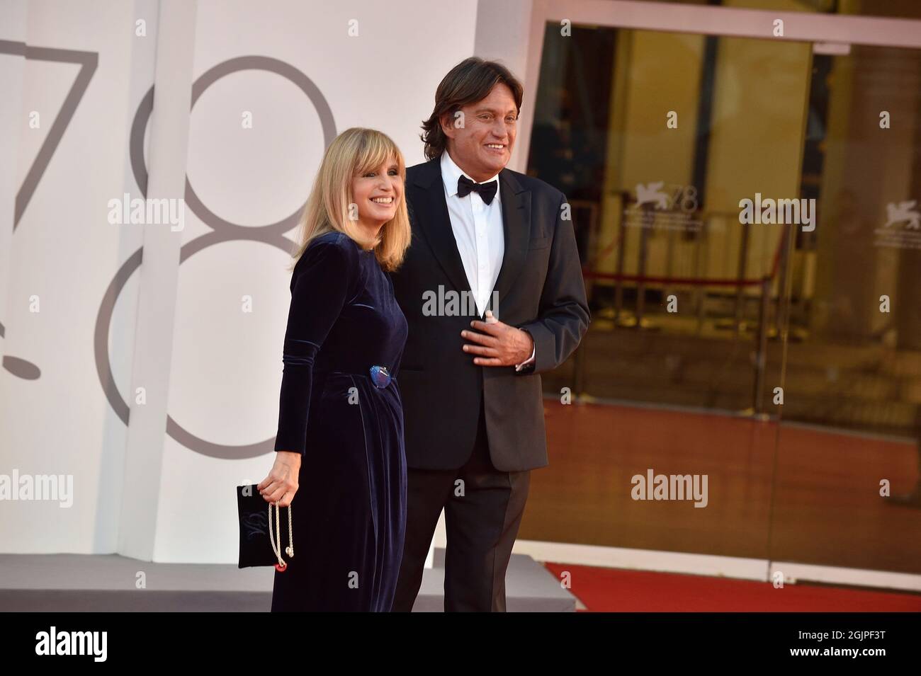 Venice, Italy. 10th Sep, 2021. VENICE, ITALY - SEPTEMBER 10:Cristiano De André, Dori Ghezzi, Cristiano De André attends the red carpet of the movie 'Deandré#Deandré Storia Di Un Impiegato' during the 78th Venice International Film Festival on September 10, 2021 in Venice, Italy. Credit: dpa/Alamy Live News Stock Photo