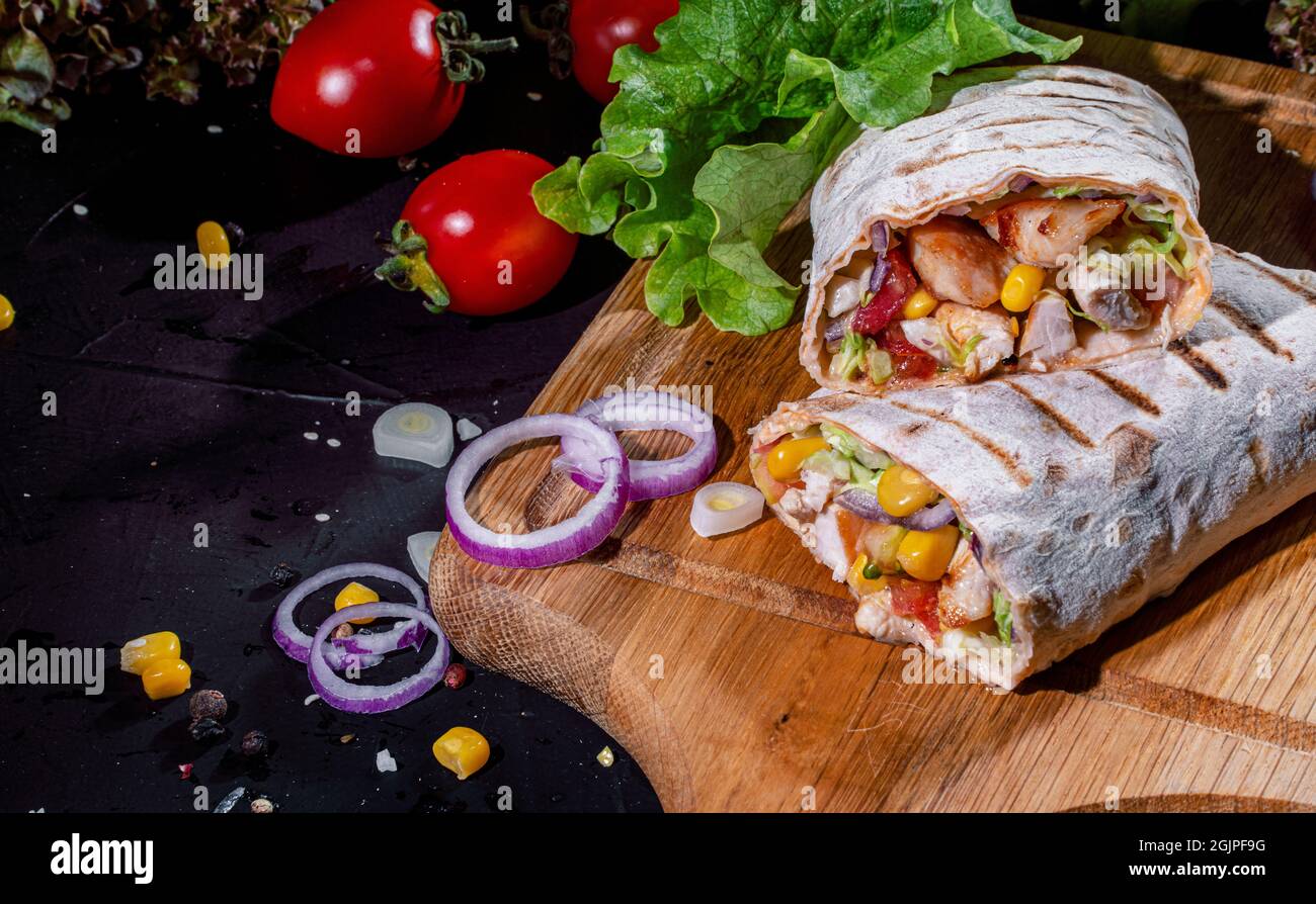 Shawarma sandwich gyro fresh roll of lavash (pita bread) with grilled