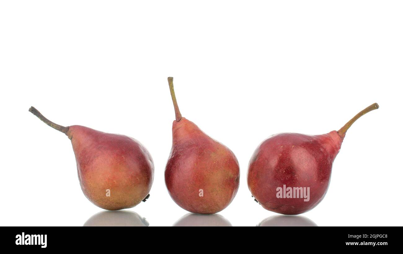 Three ripe red pears , close-up, isolated on white Stock Photo - Alamy