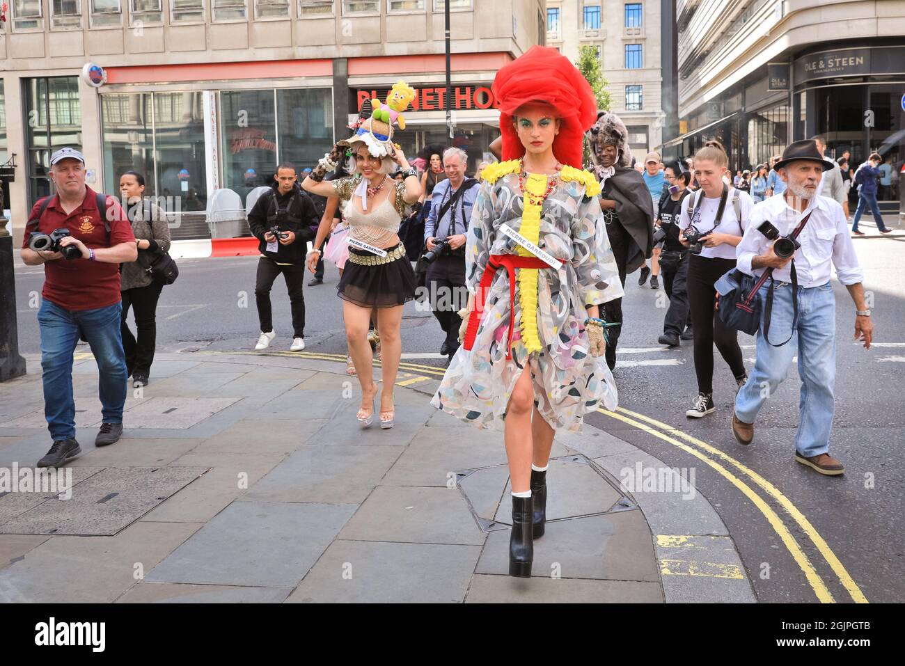 London, UK. 11th Sep, 2021. Models pose in extravagant outfits and accessories at a flashmob street fashion show for designer Pierre Garroudi in the streets of central London. Credit: Imageplotter/Alamy Live News Stock Photo