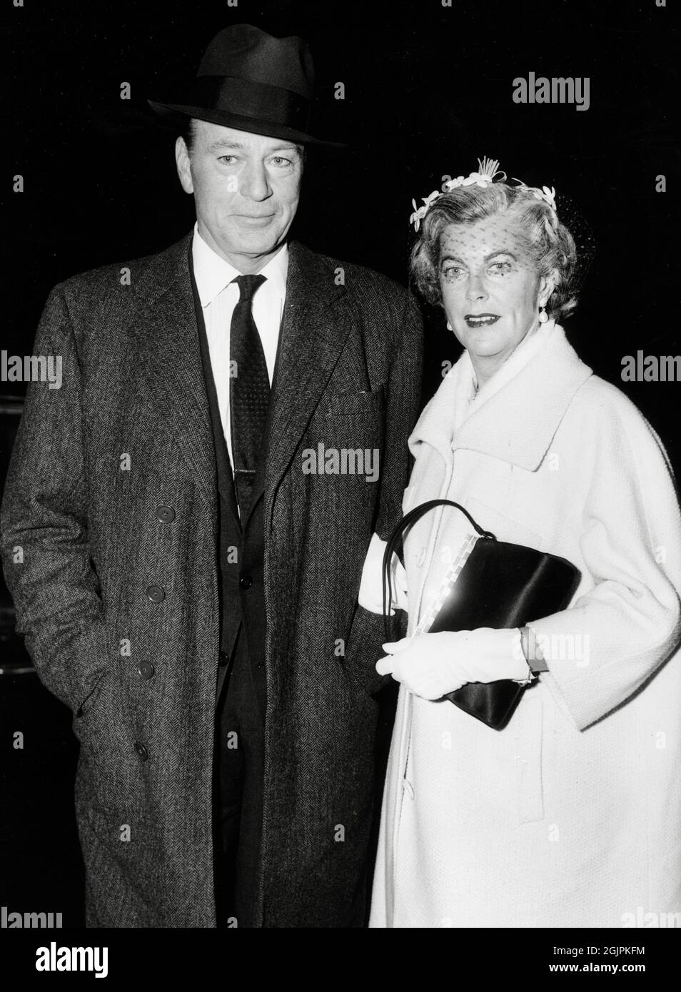 Gary Cooper and his wife, Veronica Balfe, attend the film premiere of 'The Hanging Tree' at the Roxy Theatre in New York City, circa 1959 / File Reference # 34145-462THA Stock Photo
