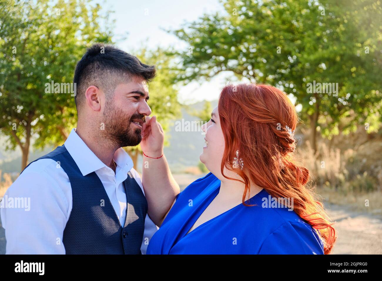Woman touches man smiling Stock Photo