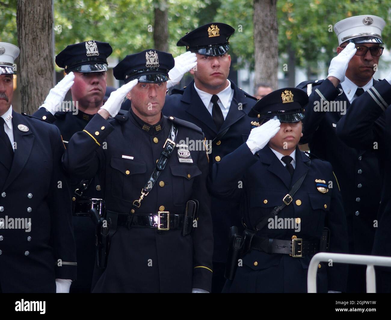 September 11, 2021, New York, New York, USA: New York, 9.11 20th Anniversary Ceremony held at Ground Zero. Families and Friends gather to hear the names of the victims of the World Trade Center Attack. Families place flowers and photographs on the names of the victims. (Credit Image: © Bruce Cotler/ZUMA Press Wire) Stock Photo