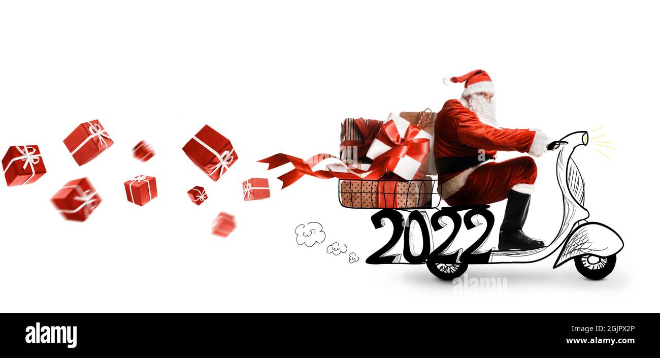 Santa Claus on scooter delivering Christmas or New Year 2022 gifts on white background Stock Photo