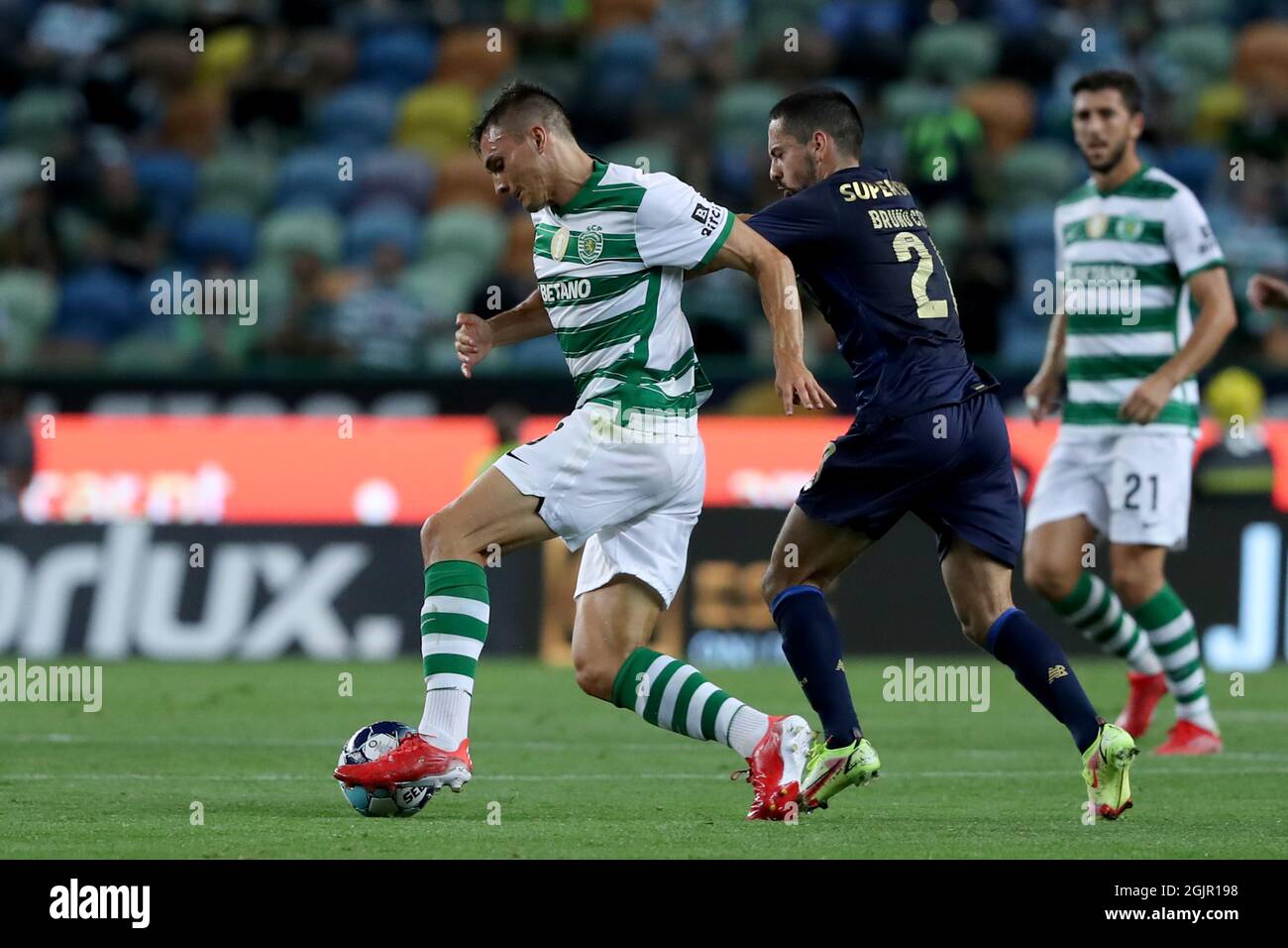 Lisbon, Portugal. 11th Sep, 2021. Joao Palhinha of Sporting CP (L) vies with Bruno Costa of FC Porto during the Portuguese League football match between Sporting CP and FC Porto at Jose Alvalade stadium in Lisbon, Portugal on September 11, 2021. (Credit Image: © Pedro Fiuza/ZUMA Press Wire) Stock Photo