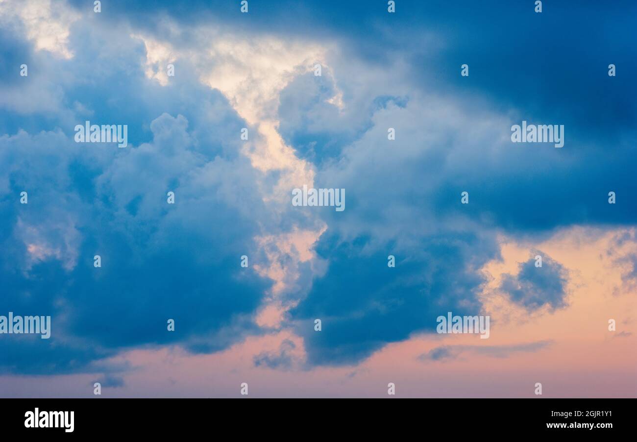 Sunset cloudscape with blue stratocumulus castellanus clouds. Rangeley, ME, US. Stock Photo