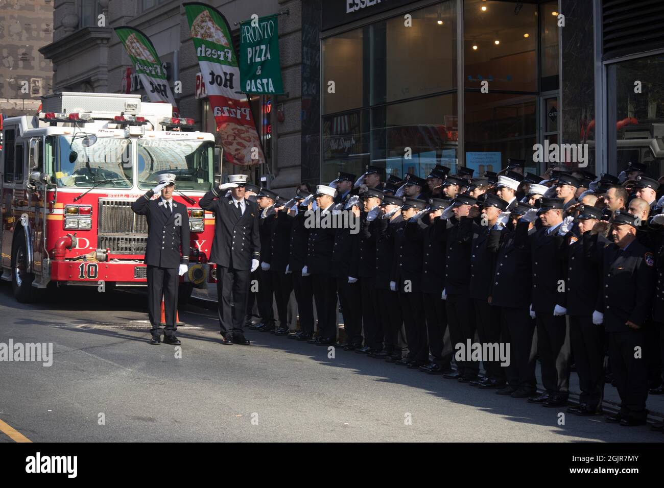 Members of FDNY Ten House, Engine Company 10 and Ladder Company 10, stand at attention in remembrance of the 343 firefighters who gave their lives on 9/11/01, on the 20th anniversary of the September 11, 2001 terrorist attack on the World Trade Center and the Pentagon in New York, New York, on Saturday, September 11, 2021.Credit: Allan Tannenbaum for CNP/Sipa USA Credit: Sipa USA/Alamy Live News Stock Photo