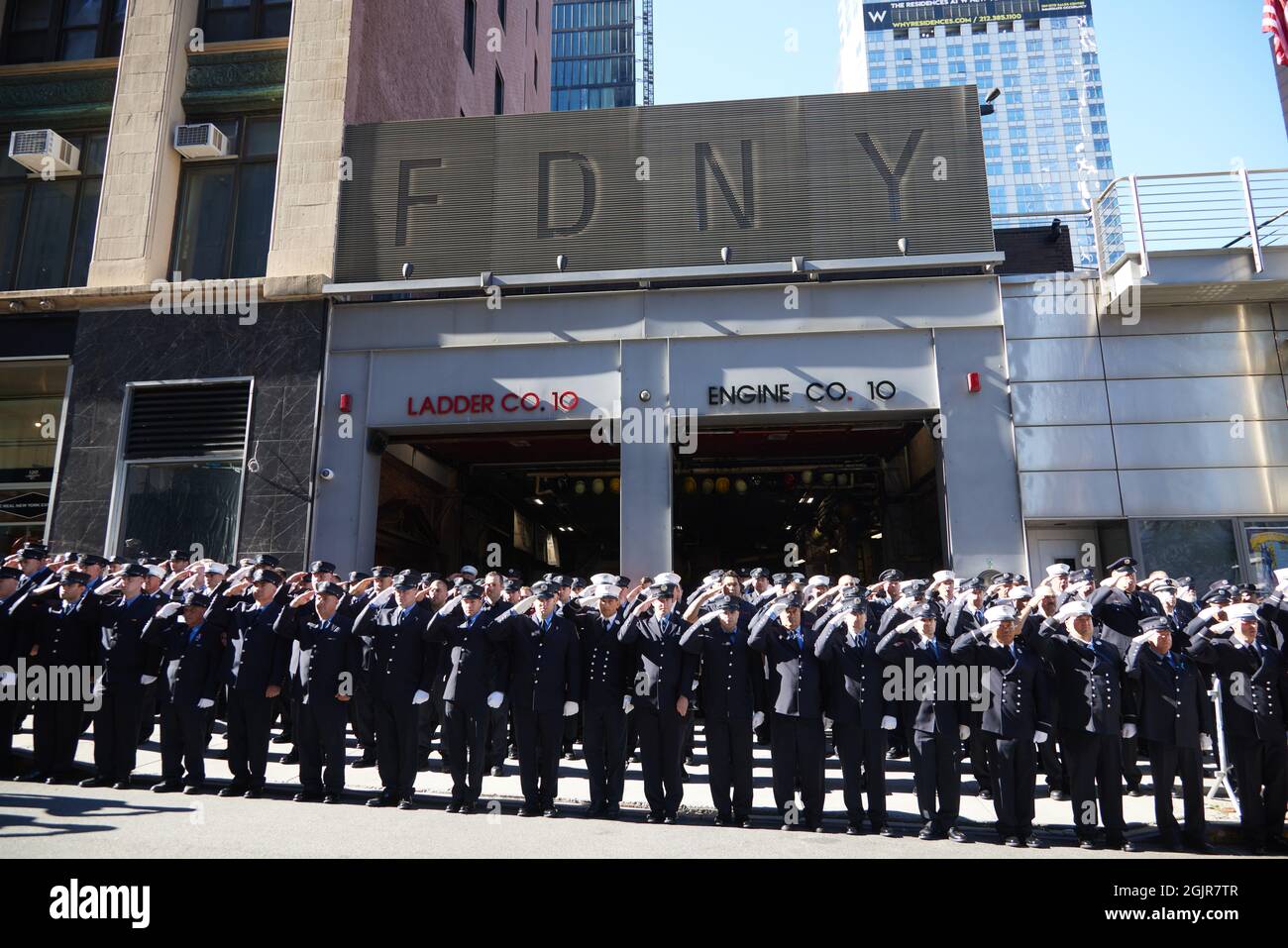 Members of FDNY Ten House, Engine Company 10 and Ladder Company 10, stand at attention in remembrance of the 343 firefighters who gave their lives on 9/11/01, on the 20th anniversary of the September 11, 2001 terrorist attack on the World Trade Center and the Pentagon in New York, New York, on Saturday, September 11, 2021.Credit: Allan Tannenbaum for CNP/Sipa USA Credit: Sipa USA/Alamy Live News Stock Photo