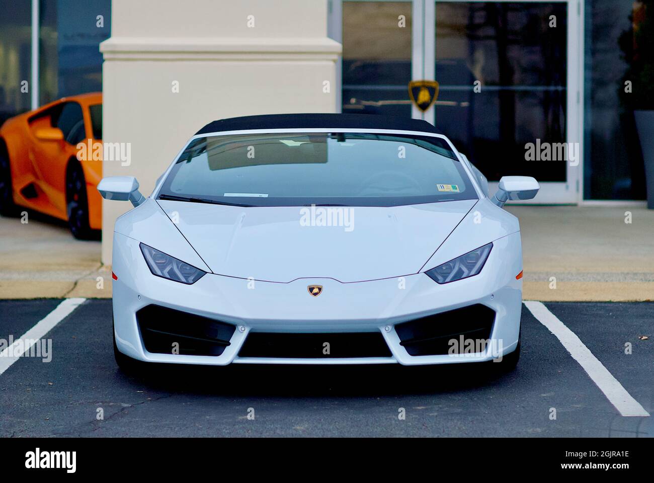 Sterling, Virginia, USA - December 9, 2018: Close-up of a white Lamborghini luxury sports car parked at the Lamborghini Sterling car dealership. Stock Photo