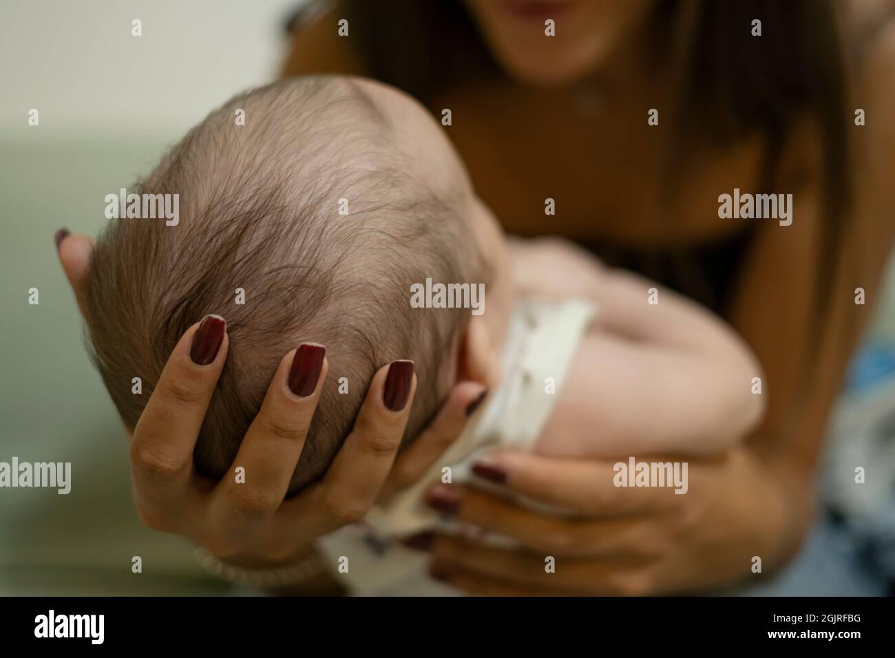 Young mother play with adorable newborn child boy,family love concept relationship Stock Photo