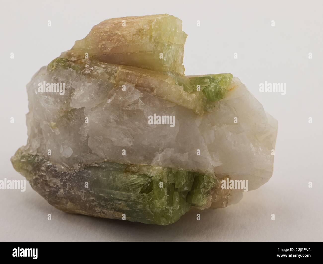 Colored tourmaline on matrix on white background Stock Photo