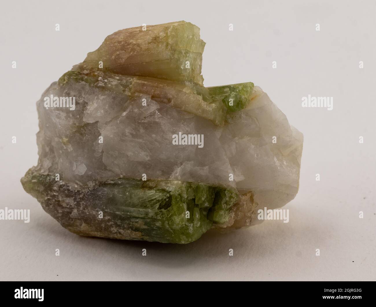 Colored tourmaline on matrix on white background Stock Photo