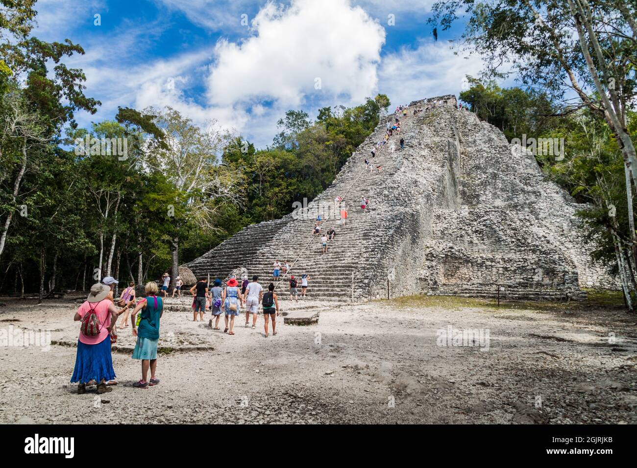 COBA, MEXICO - MARCH 1, 2016: Tourist visit the Pyramid Nohoch Mul at the ruins of the Mayan city Coba, Mexico Stock Photo