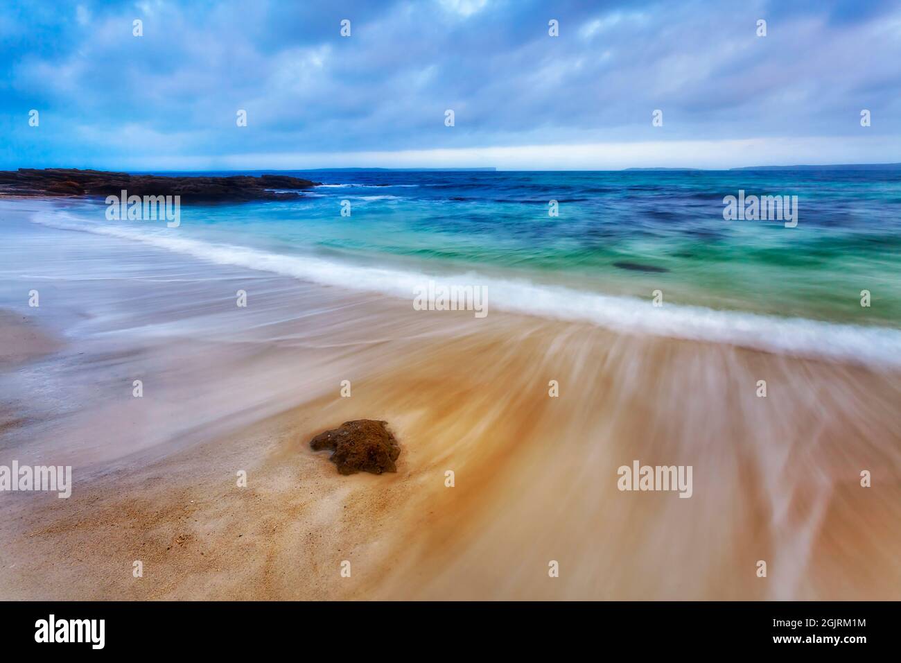Jervis bay pristine white sands of Hyams and Chinamans beaches at sunset - scenic seascape of Pacific ocean in Australia. Stock Photo