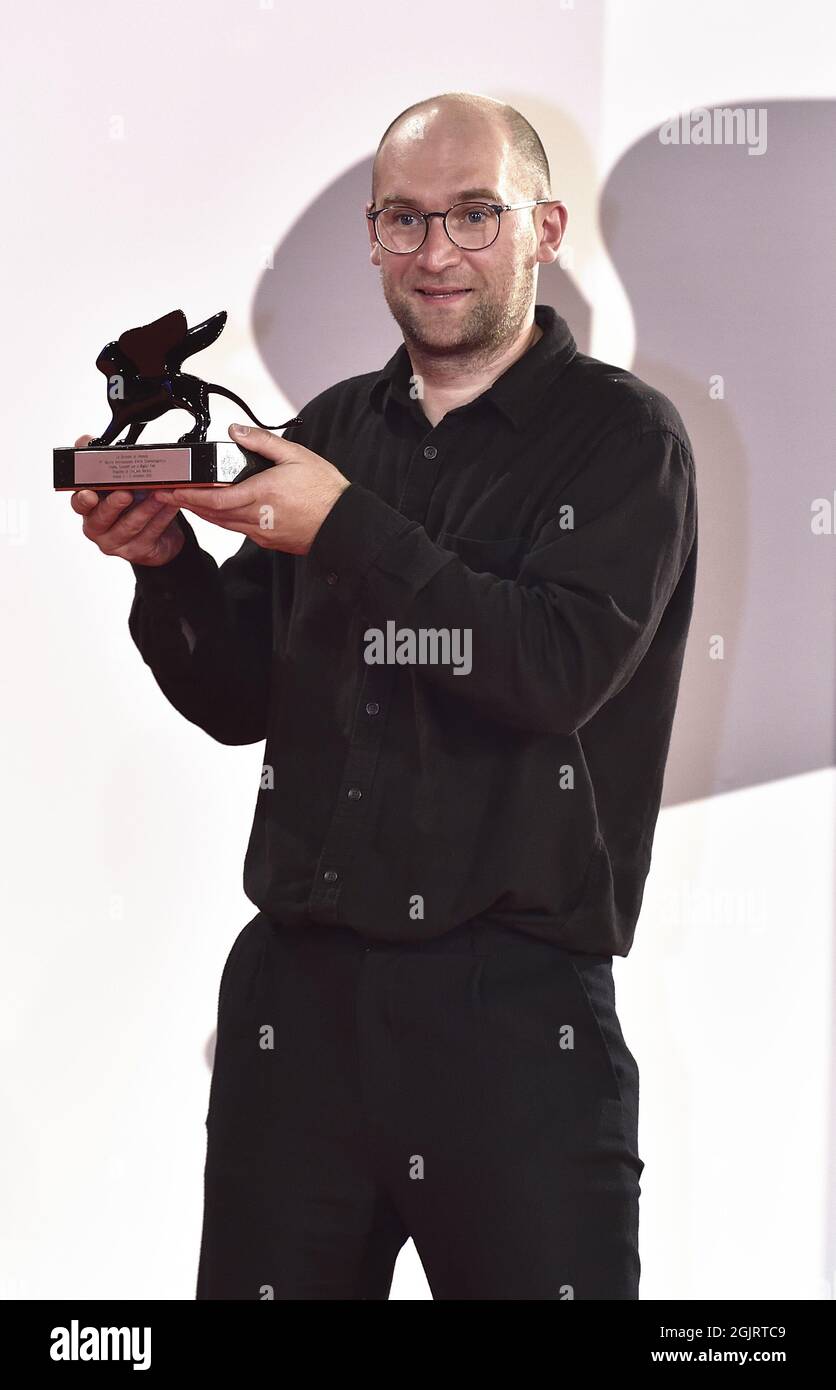 Venice, Italy. 11th Sep, 2021. Director Laurynas Bareisa poses with the Orizzonti Award for Best Film for 'Piligrimai' (Pilgrims) at the awards winner photocall during the 78th Venice International Film Festival on Saturday, September 11, 2021 in Venice, Italy. Photo by Rocco Spaziani/UPI Credit: UPI/Alamy Live News Stock Photo