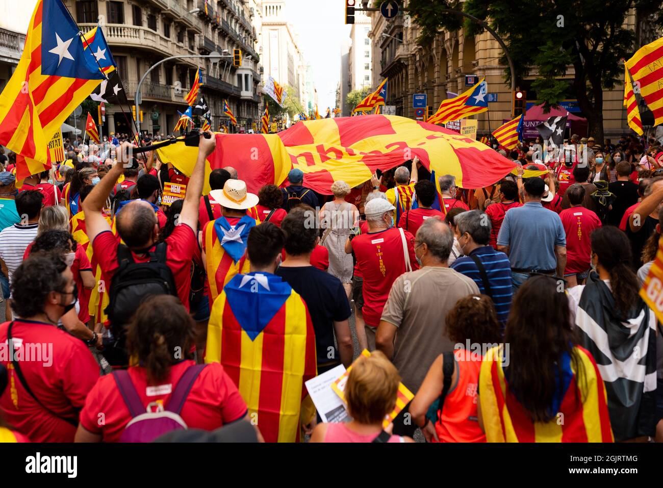 Esp. 11th Sep, 2021. People is seen holding catalan flags, known as Señera, and placards during the celebrations and marches hold for the catalan holiday known as 'Diada' in Barcelona, Spain on September 11, 2021. Pro independence and catalan separatists parties such as ANC called for people to take the street in the first major concentration since the covid pandemic began, to remember the fall of Barcelona during the War of the Spanish Succession in 1714. (Photo by Davide Bonaldo/Sipa USA) Credit: Sipa USA/Alamy Live News Stock Photo