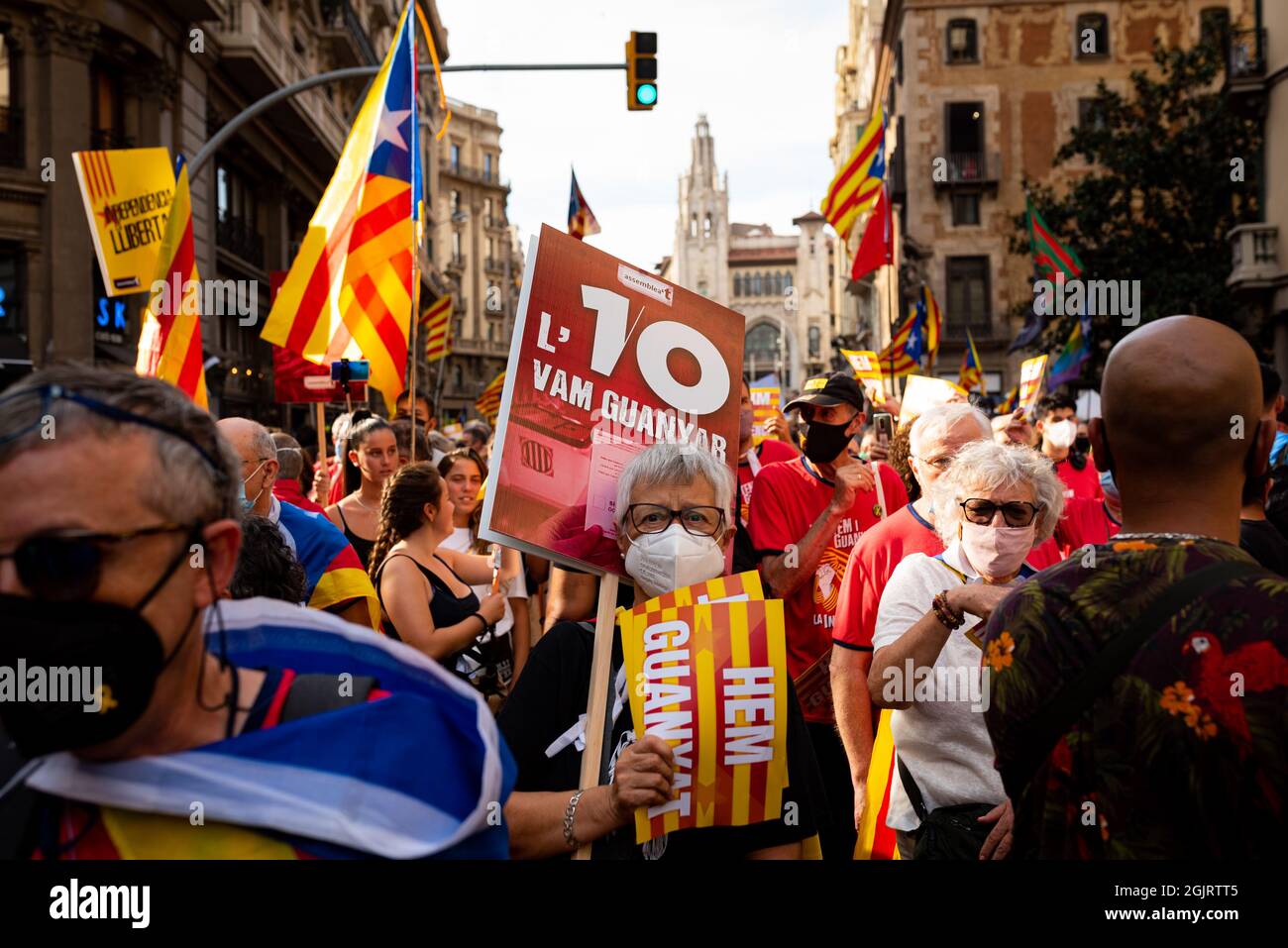 Esp. 11th Sep, 2021. People is seen holding catalan flags, known as Señera, and placards during the celebrations and marches hold for the catalan holiday known as 'Diada' in Barcelona, Spain on September 11, 2021. Pro independence and catalan separatists parties such as ANC called for people to take the street in the first major concentration since the covid pandemic began, to remember the fall of Barcelona during the War of the Spanish Succession in 1714. (Photo by Davide Bonaldo/Sipa USA) Credit: Sipa USA/Alamy Live News Stock Photo