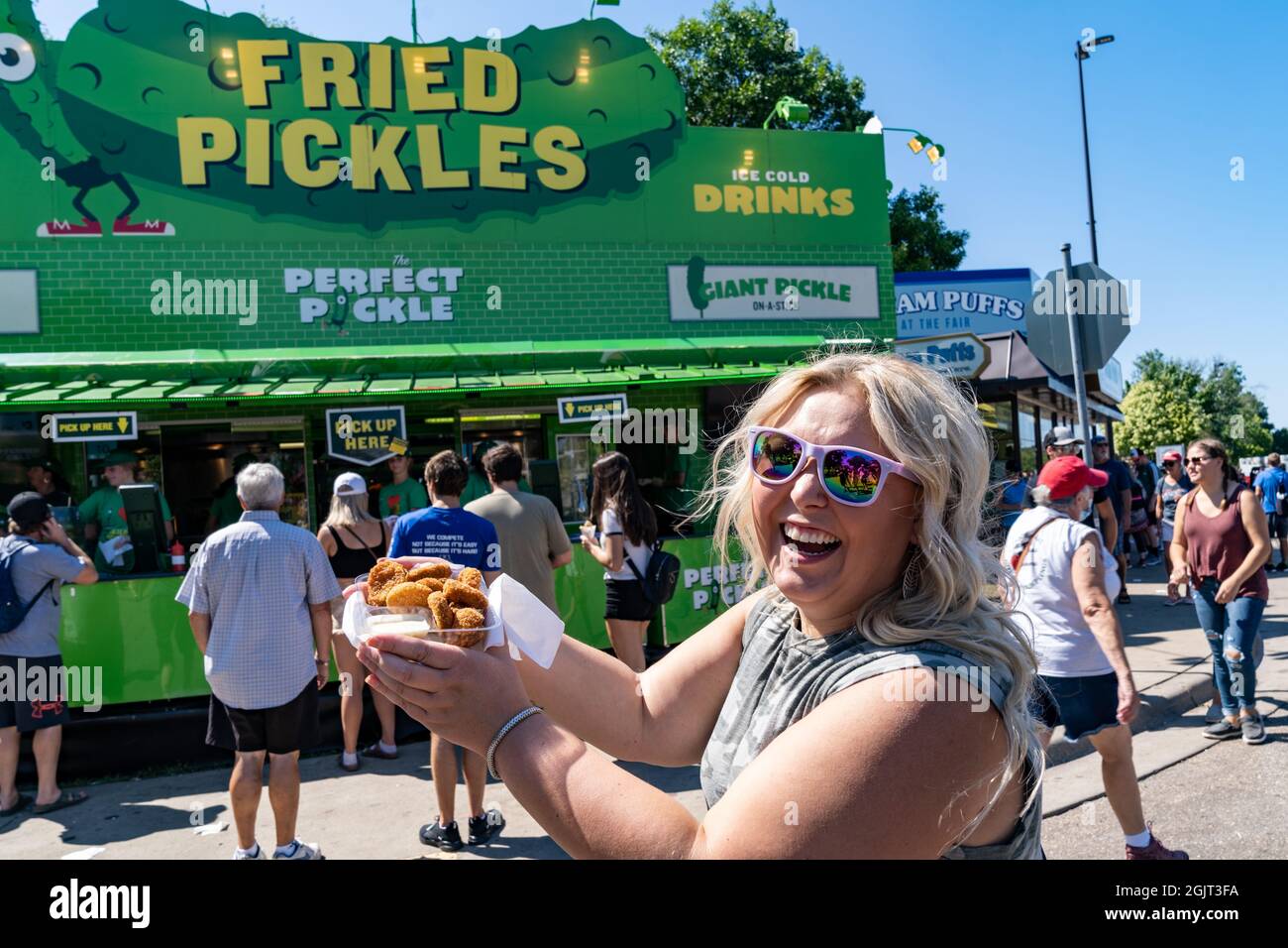 Falcon Heights, Minnesota August 30, 2021 Happy laughing woman holds