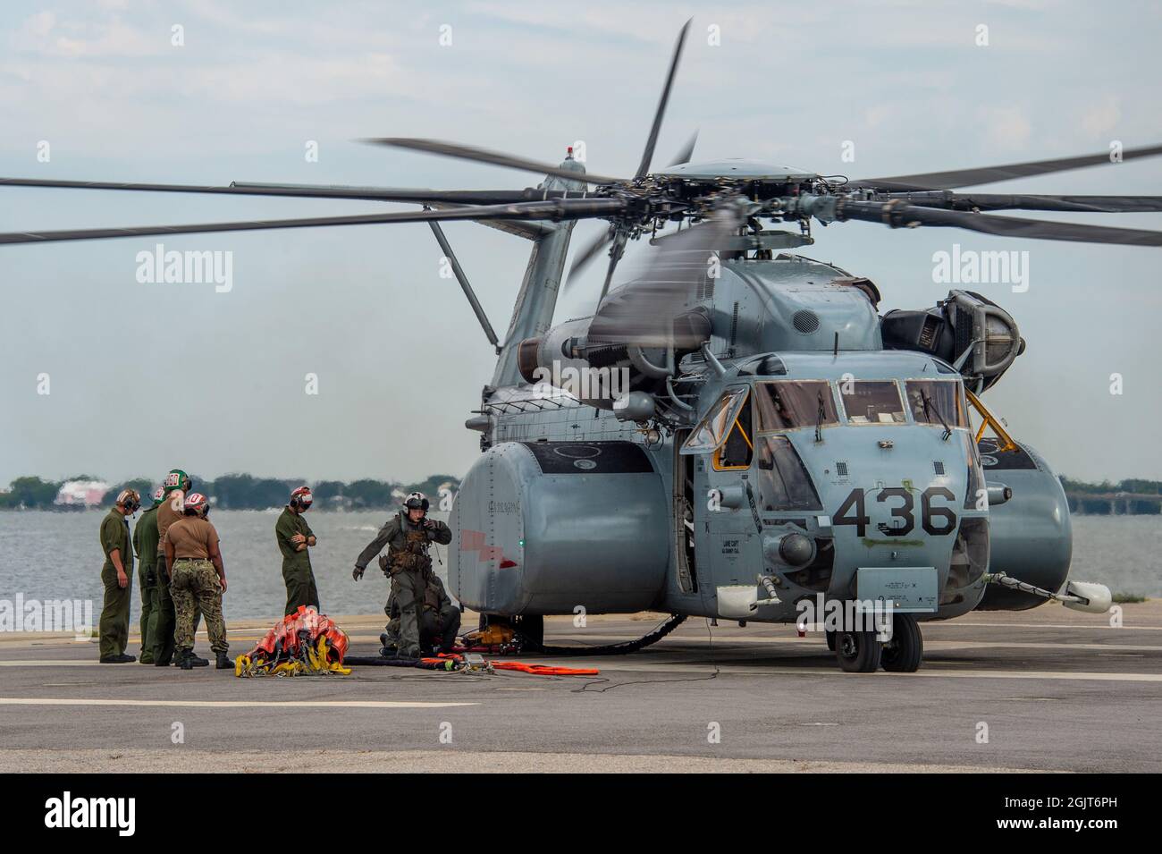 210908-N-RQ186-1117 NORFOLK, Va. (Sept. 8, 2021) Sailors assigned to  Helicopter Mine Countermeasures Squadron (HM) 12, prepare an MH-53E Sea  Dragon for Bambi Bucket training. HM-12 tested and trained their squadron  and aircrew