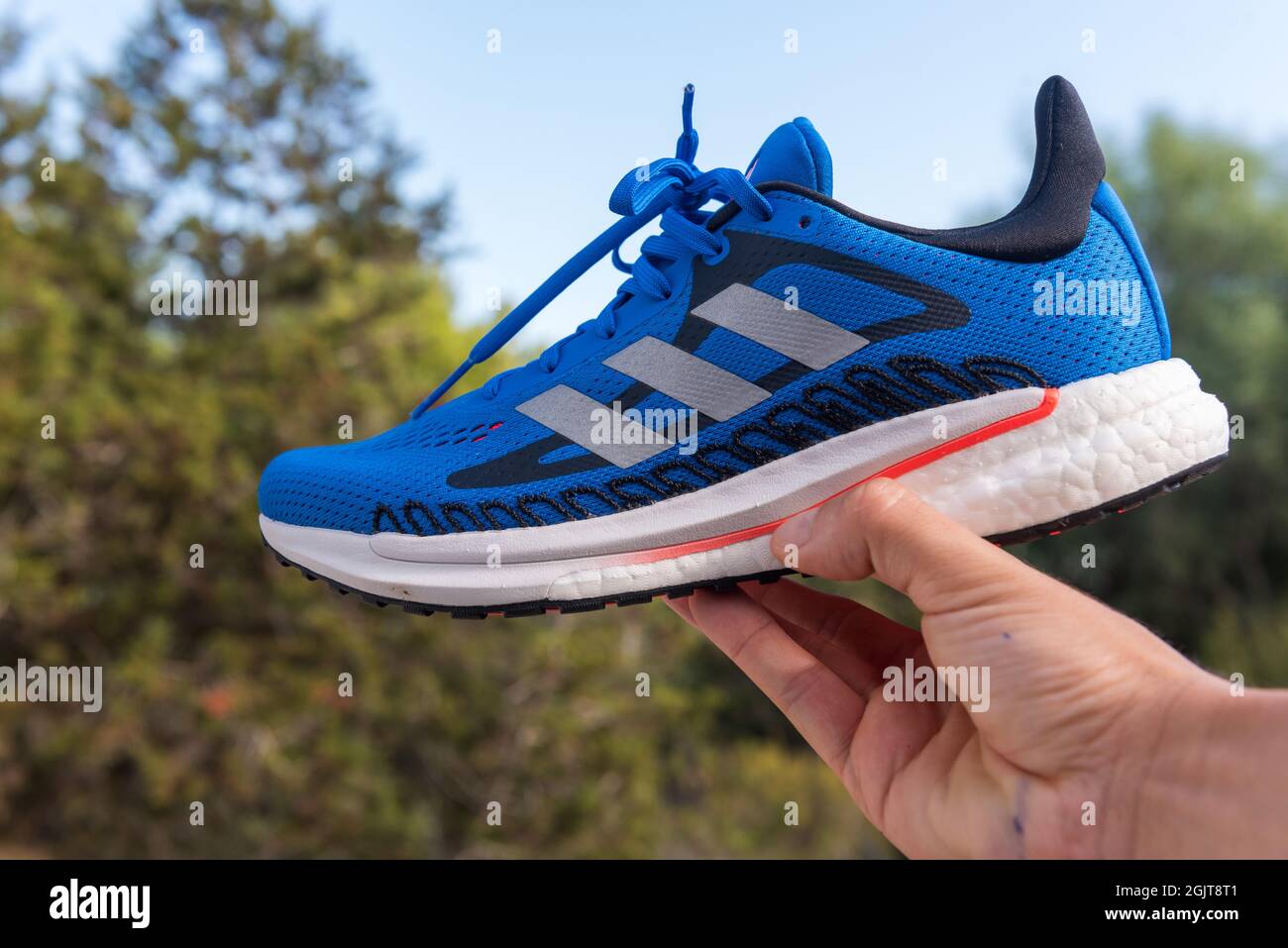 Barcelona, Spain: 2021 September 11: Adidas Solar Boast 3 sneakers with a  natural fordo in summer 2021 Stock Photo - Alamy