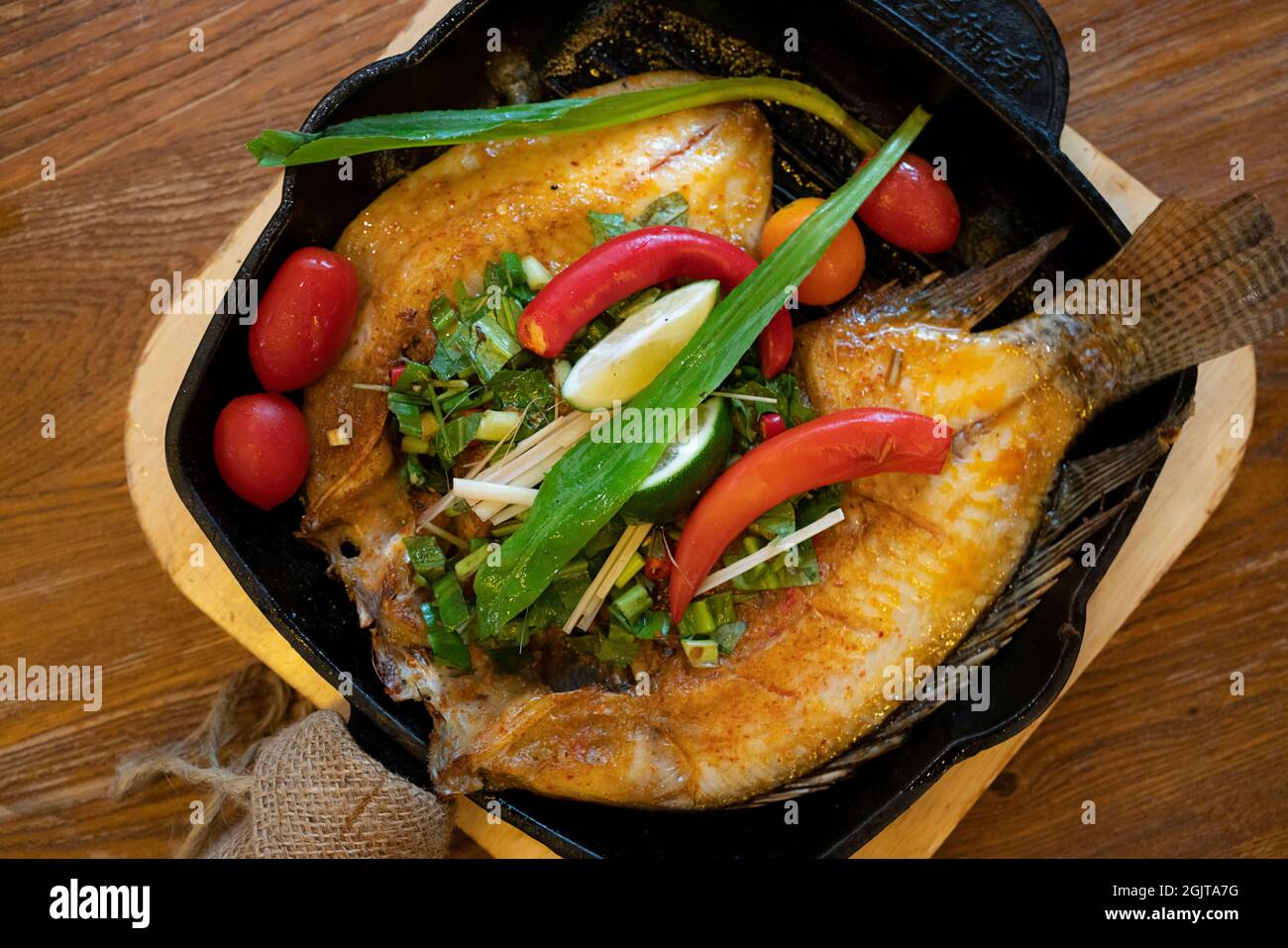 Delicious roasted tilapia with Yunnan cuisine Stock Photo