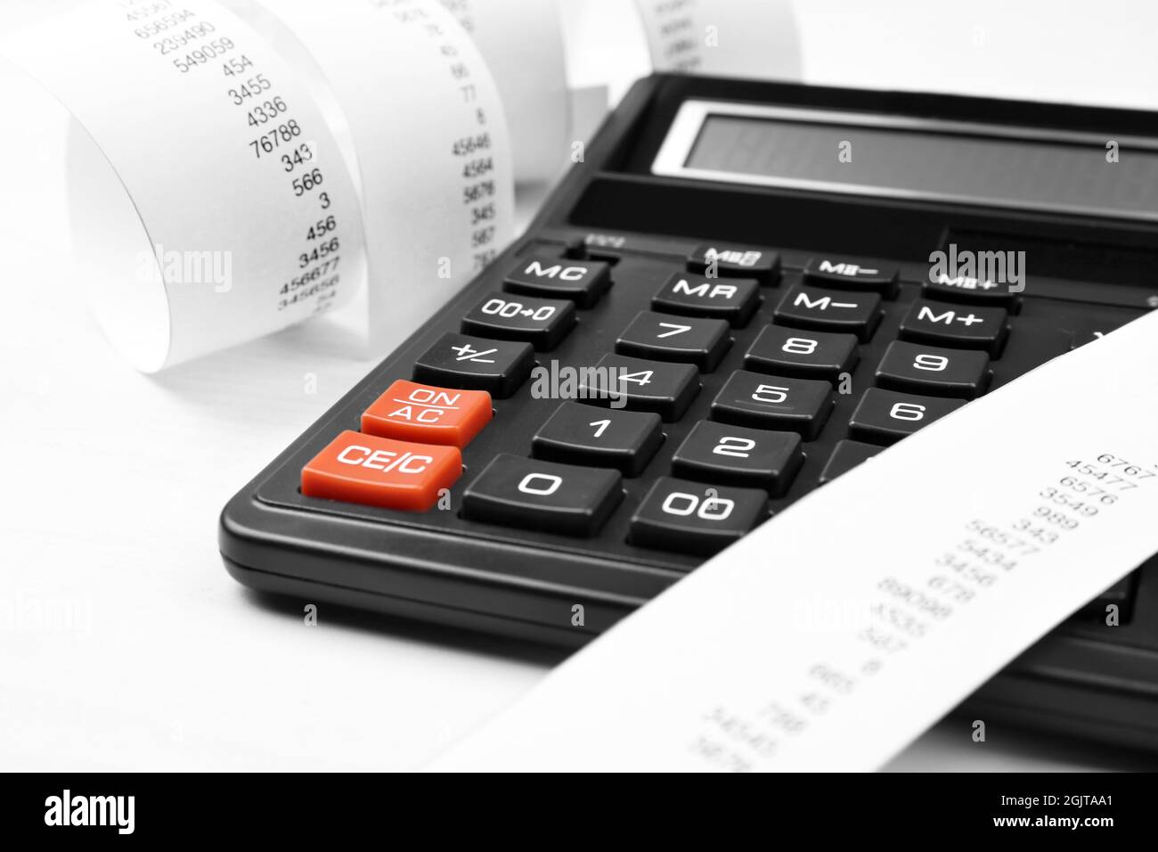 Calculator with adding machine tape closeup stock photo alamy