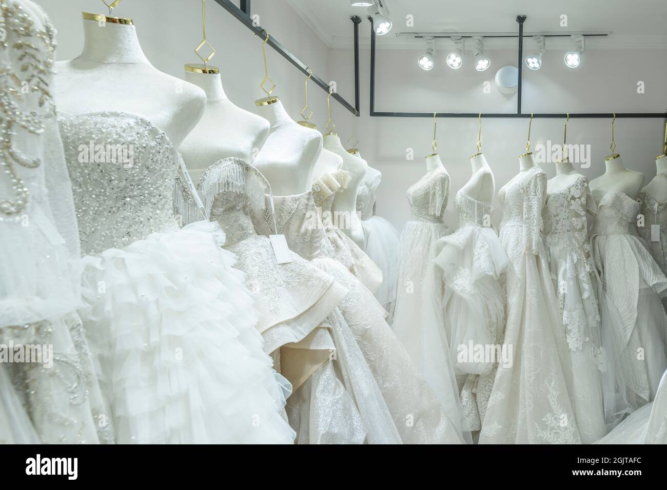 dress on hangers in a shop Stock Photo Alamy