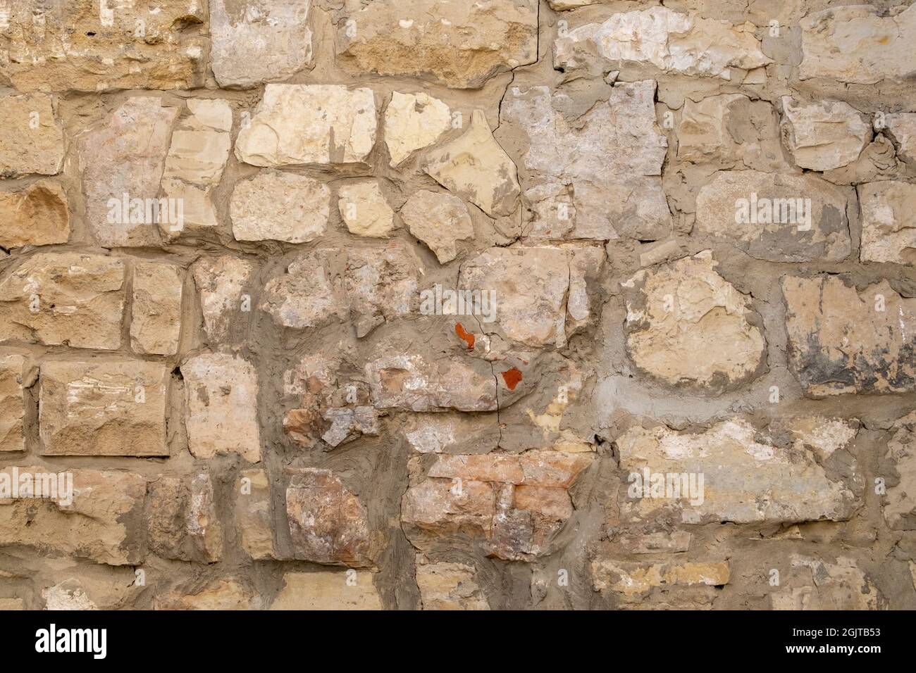Close-up of a fragment of an old white limestone wall Stock Photo