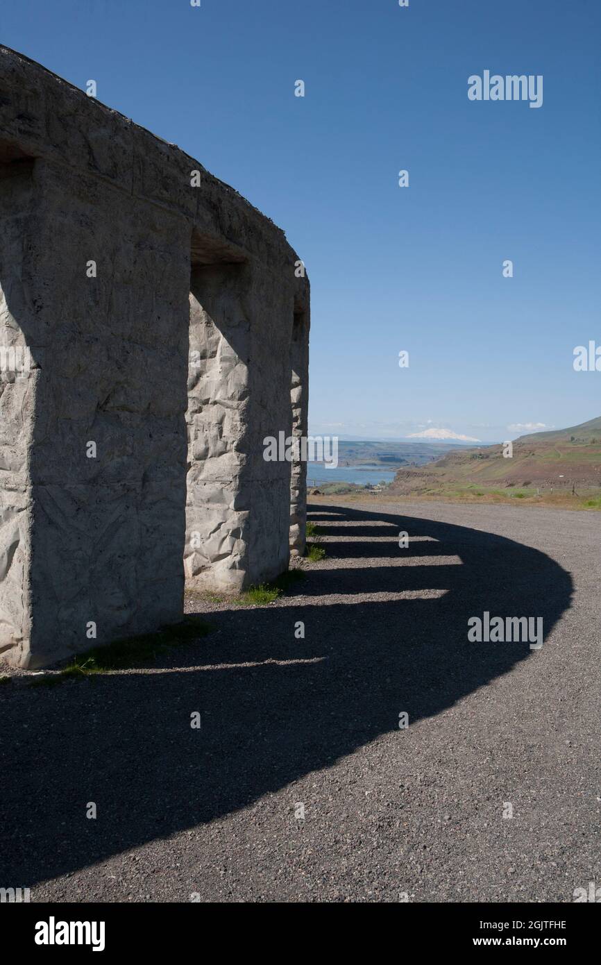 Sam Hill's replica of Stonehenge near Maryhill, Washington stands on an exposed site near the Columbia River, with view of Mount Hood. Stock Photo