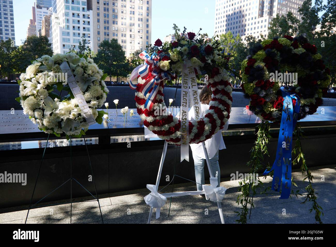 Flowers and wreaths commemorate the terror attacks of 9/11 at the ...
