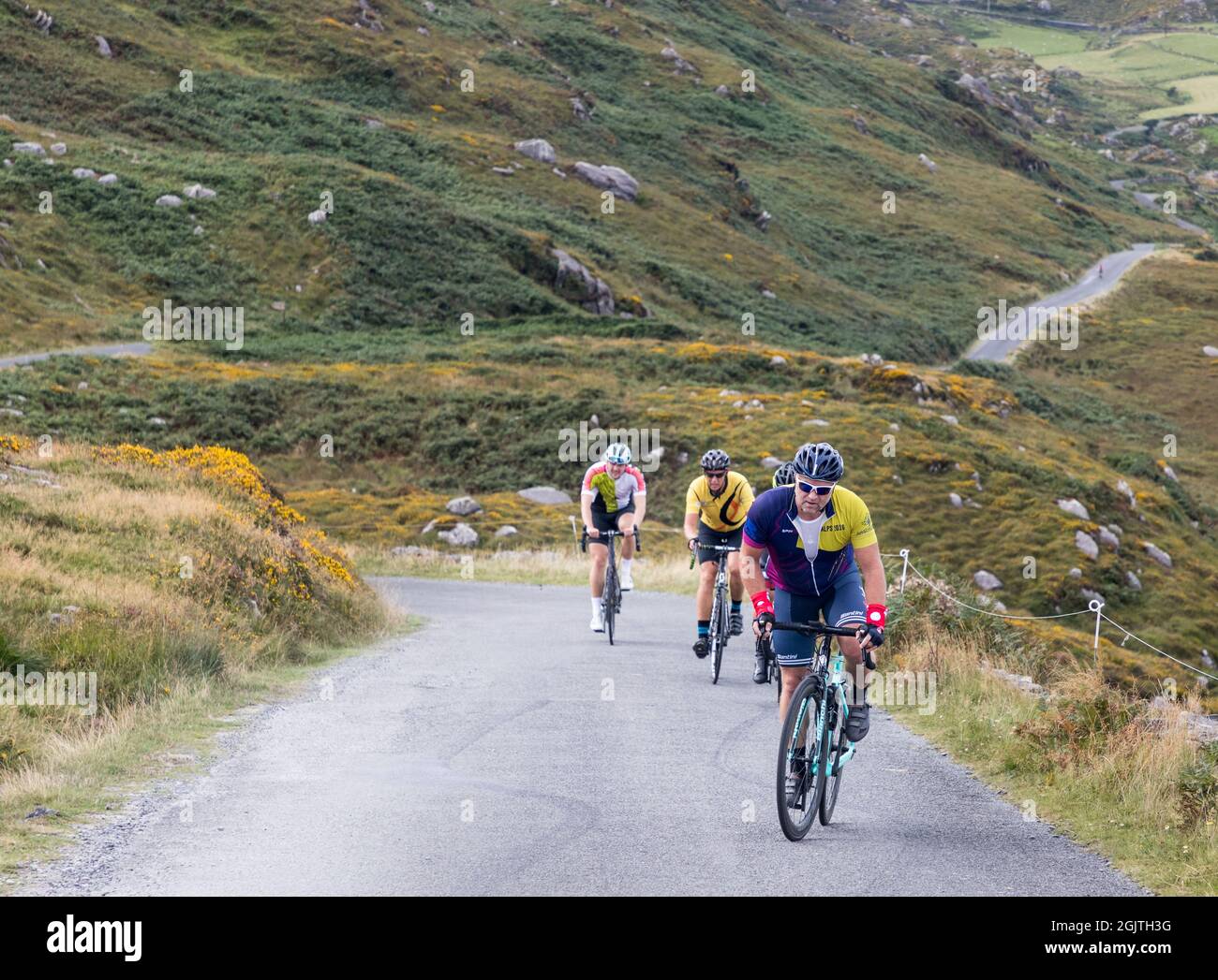 Allihies, Cork, Ireland. 11th September, 2021. Cyclists climbing their way through the Caha Mountains during the 160km Tour de Beara in aid of charity which took place against  some breathtaking scenery near Allihies in West Cork, Ireland - Picture; David Creedon /  Alamy Live News Stock Photo