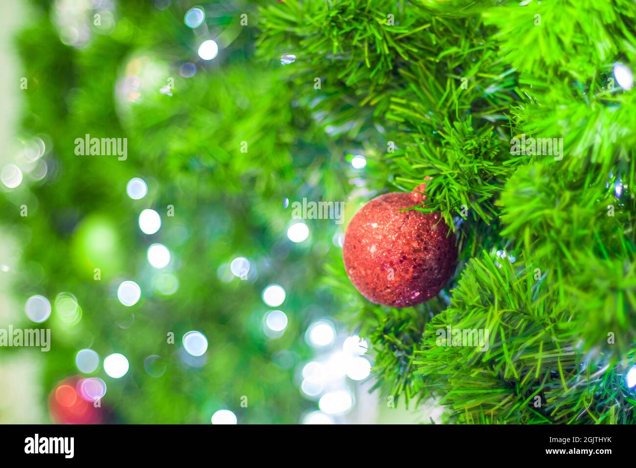 Christmas Tree red Ball And gold Bokeh Background Stock Photo - Alamy