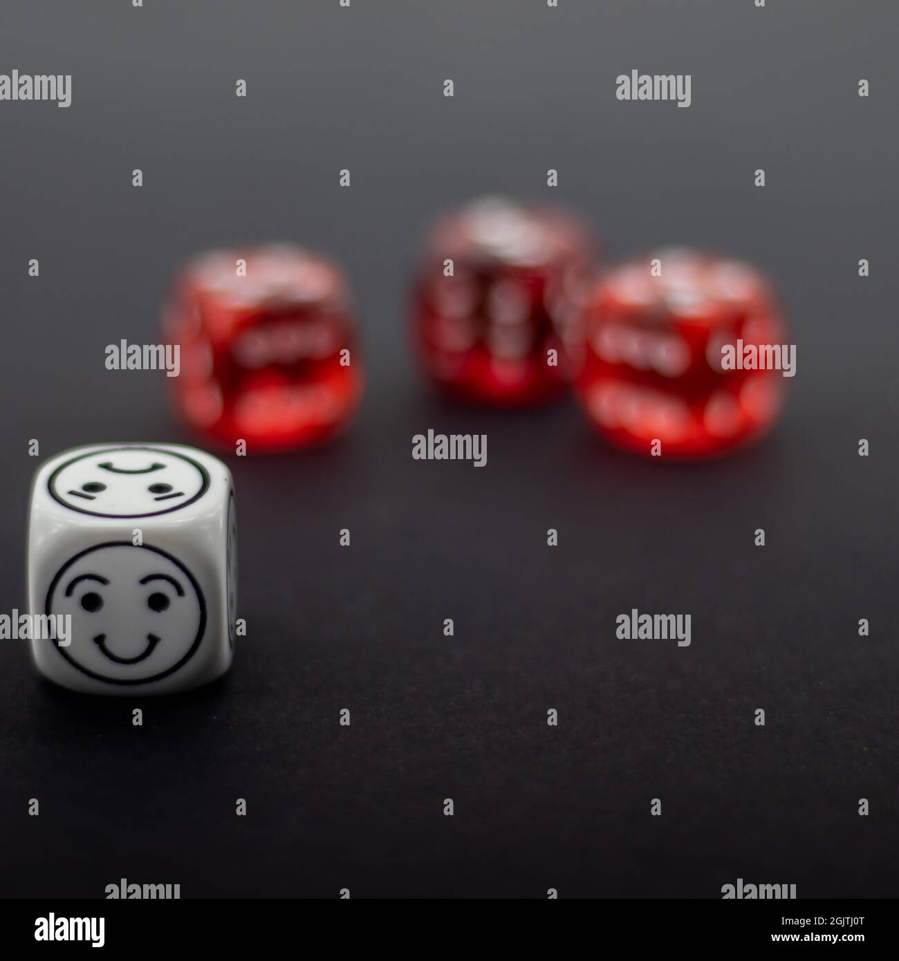 colorful dice on dark background Stock Photo