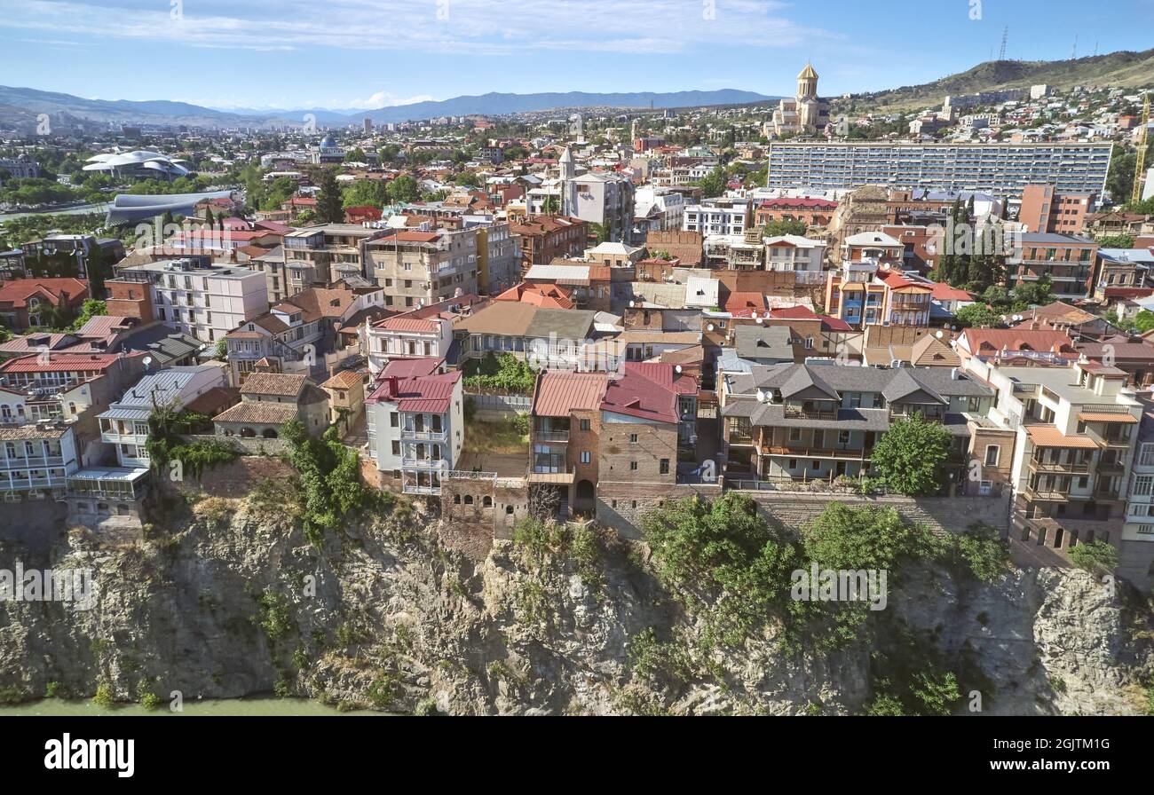 Old district of Tbilisi city aerial drone view on sunny day Stock Photo