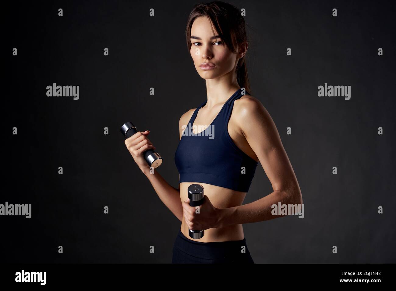 https://c8.alamy.com/comp/2GJTN48/athletic-brunette-in-workout-gym-fitness-lifestyle-2GJTN48.jpg