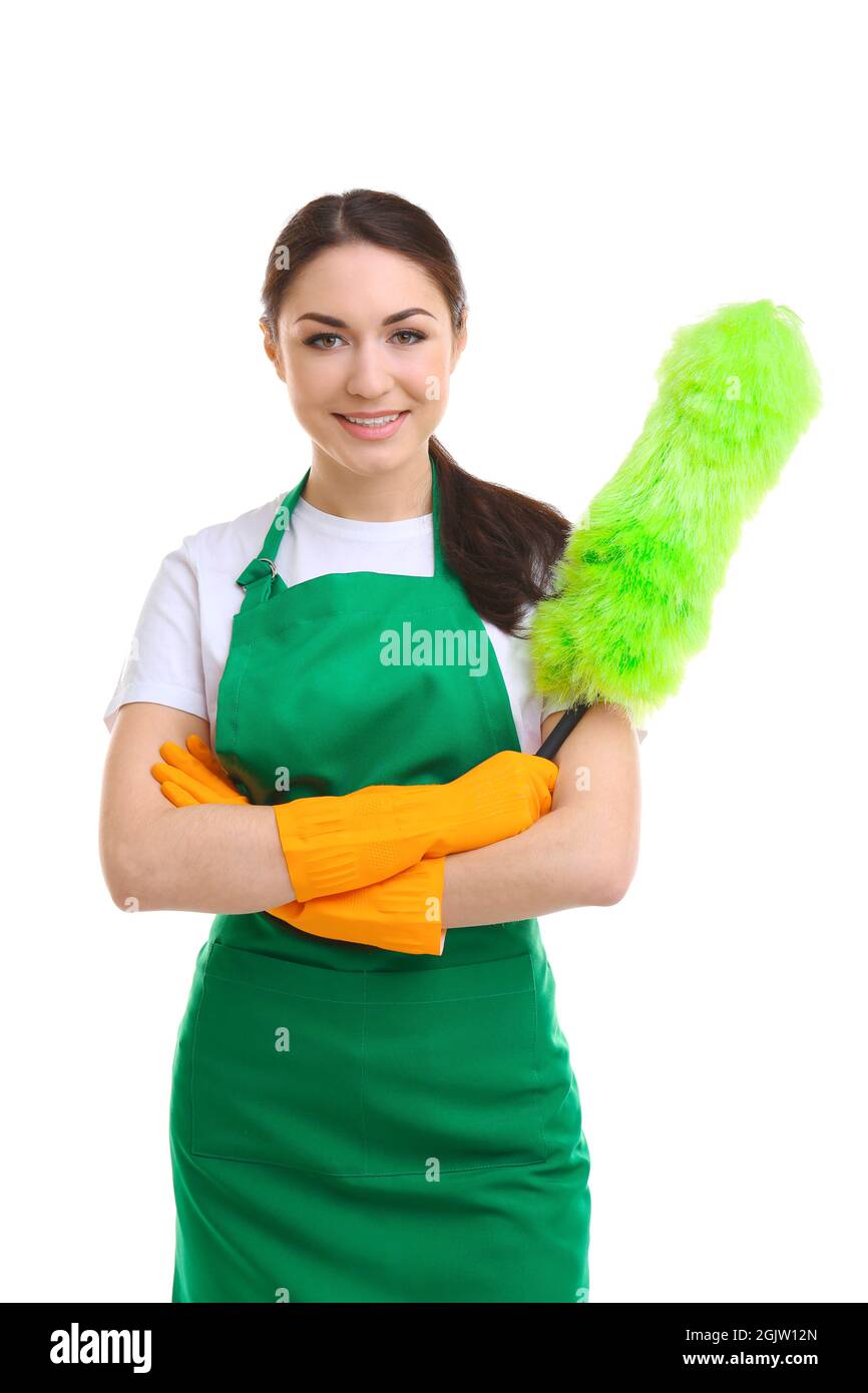 Cleaning concept. Young woman in green apron with duster on white ...