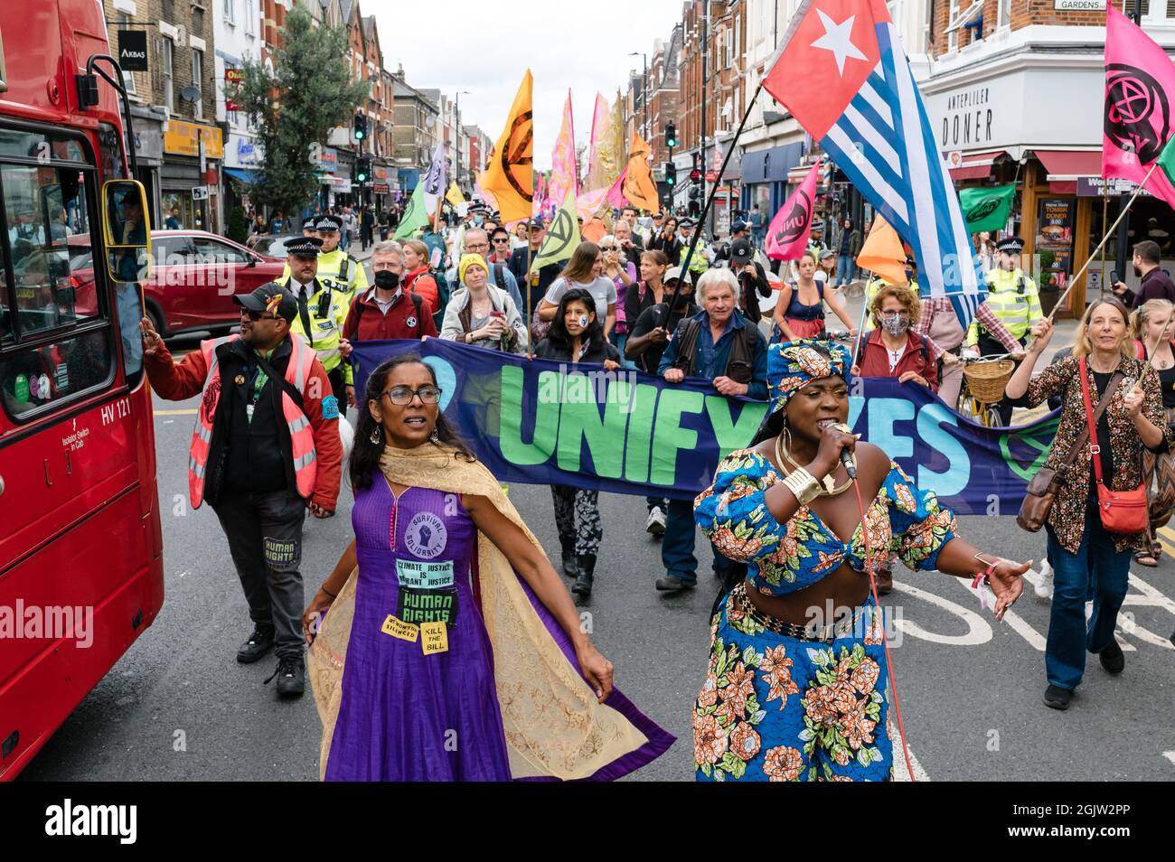 London, UK. 29 August 2021. Extinction Rebellion and XR Unify supporters march to the 'Carnival for Climate Justice' event in Finsbury Park. Stock Photo