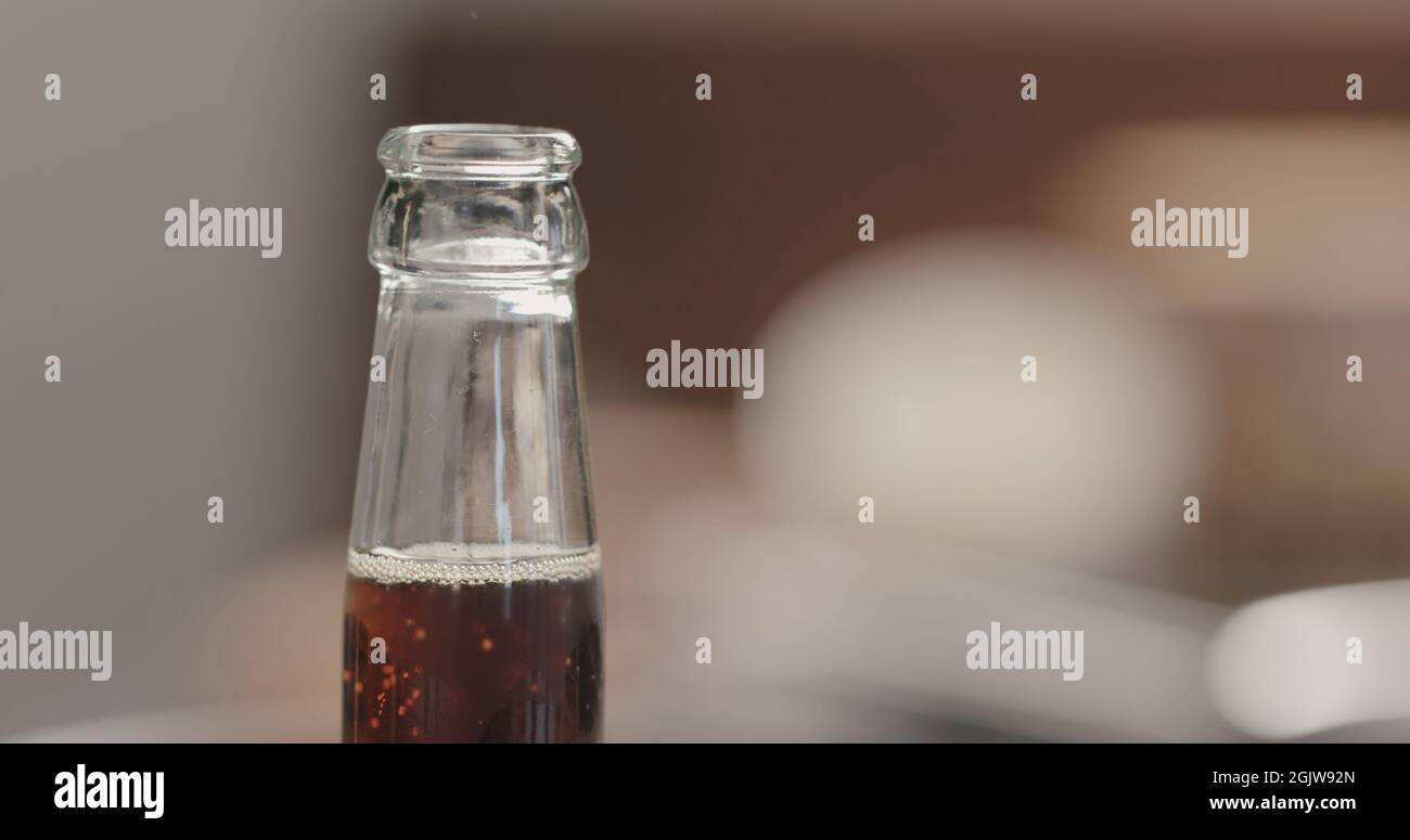 open glass bottle with fizzy drink, wide photo Stock Photo Alamy
