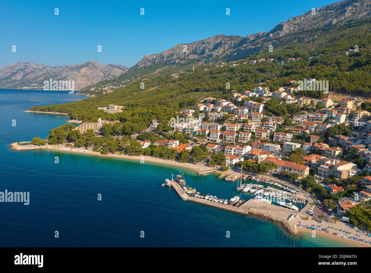 Aerial view of Brela town below Biokovo mountain, the Adriatic Sea ...