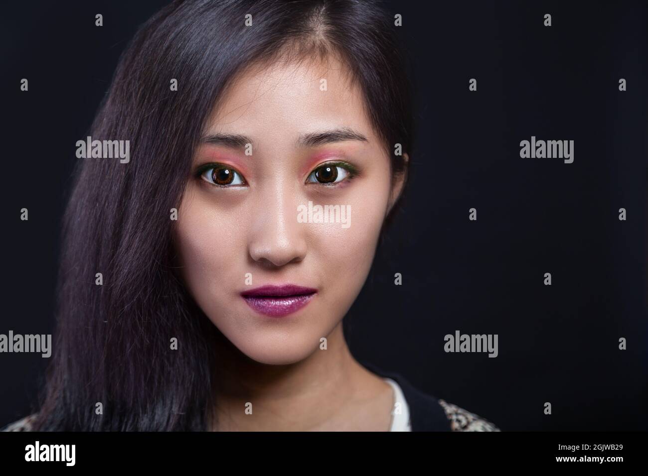 Beauty portrait of beautiful Asian American fashion model in makeup