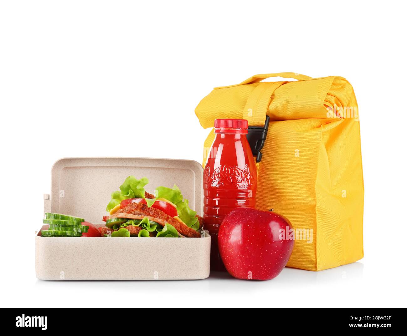 Lunch box and bag with delicious food on white background Stock Photo