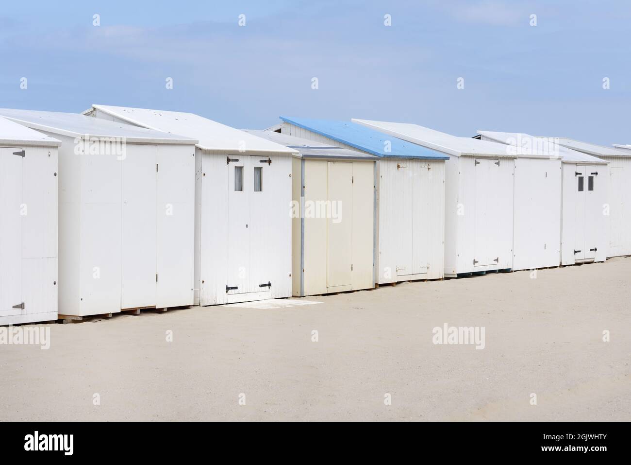 a row of closed white beach houses on the north sea coast Stock Photo