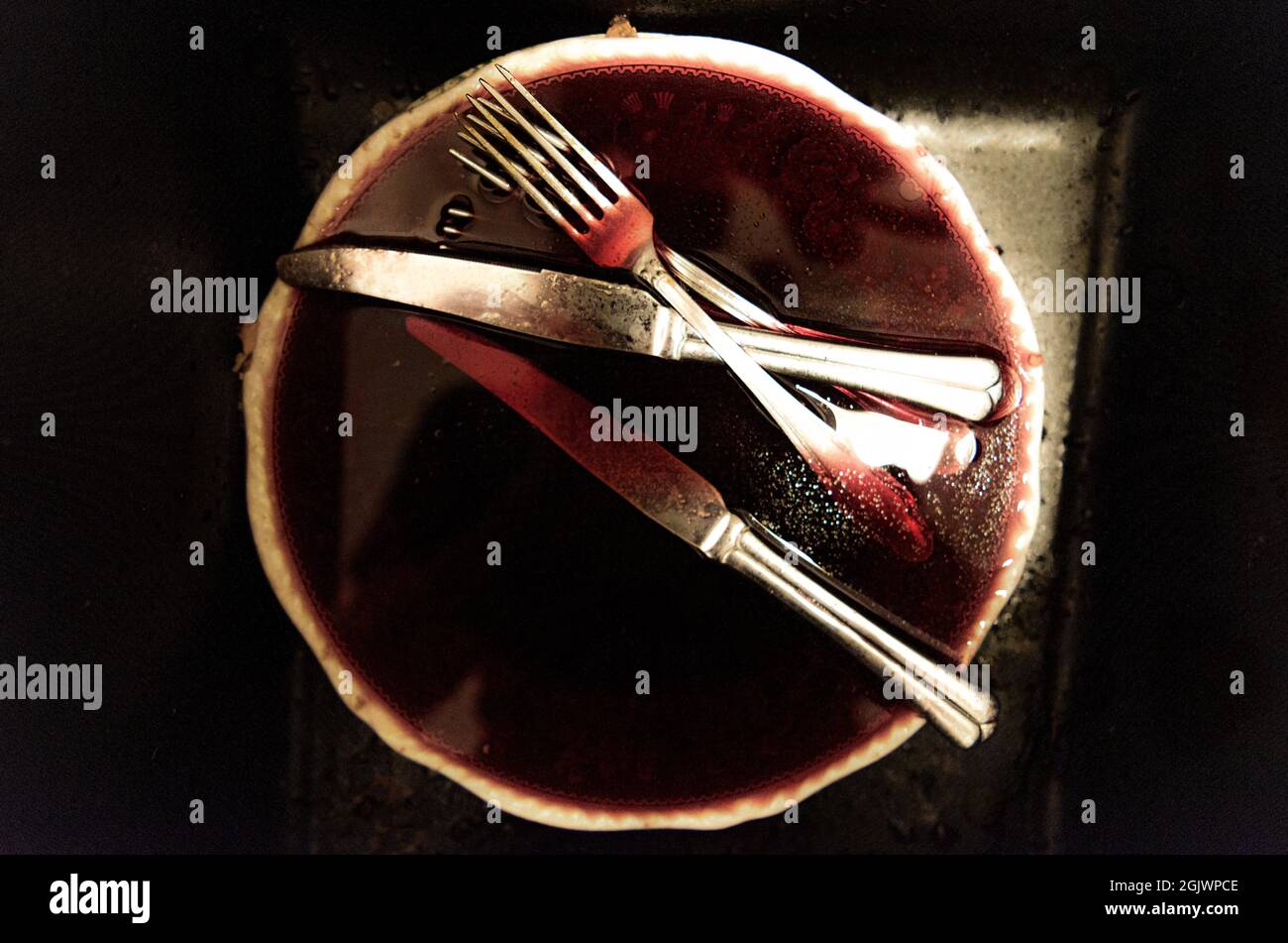 cutlery on a plate with blood Stock Photo